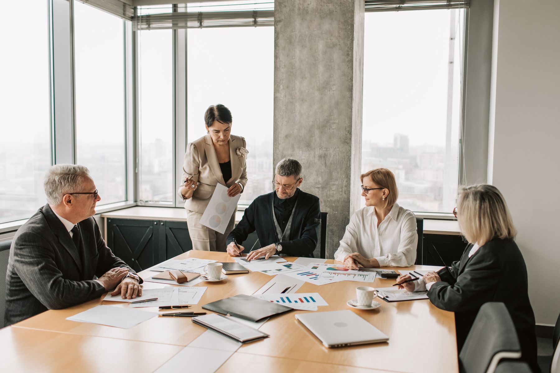 Business professionals reviewing documents together